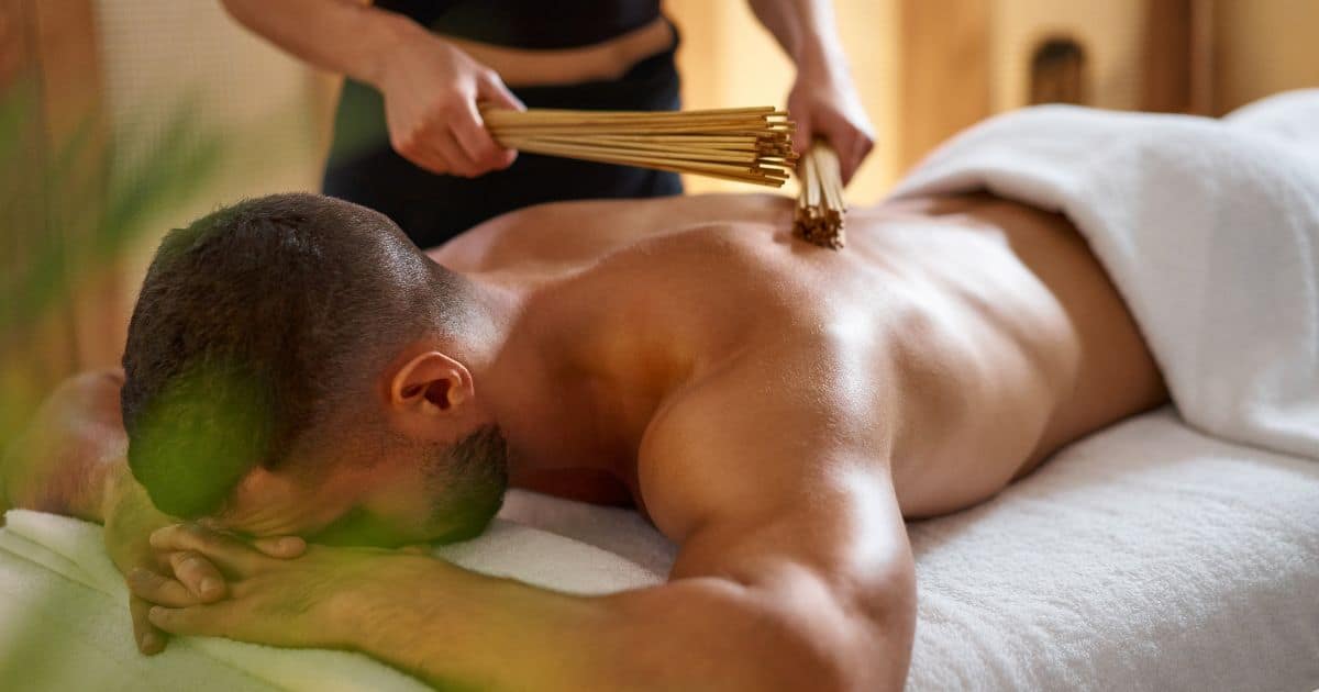 man laying face down getting a massage