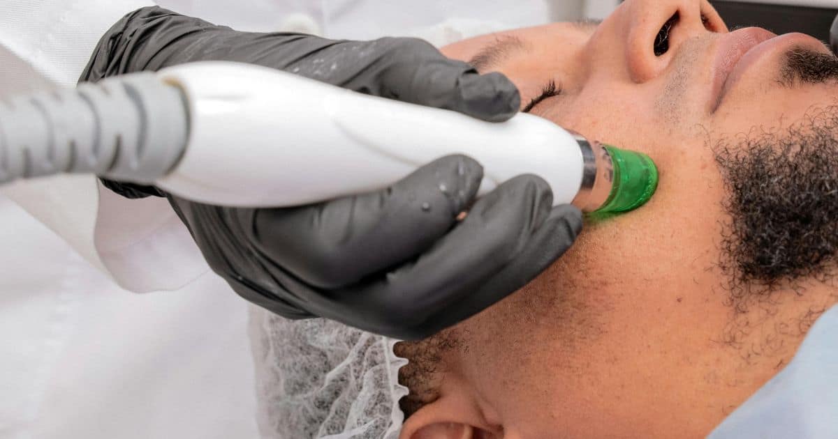man getting laser to face