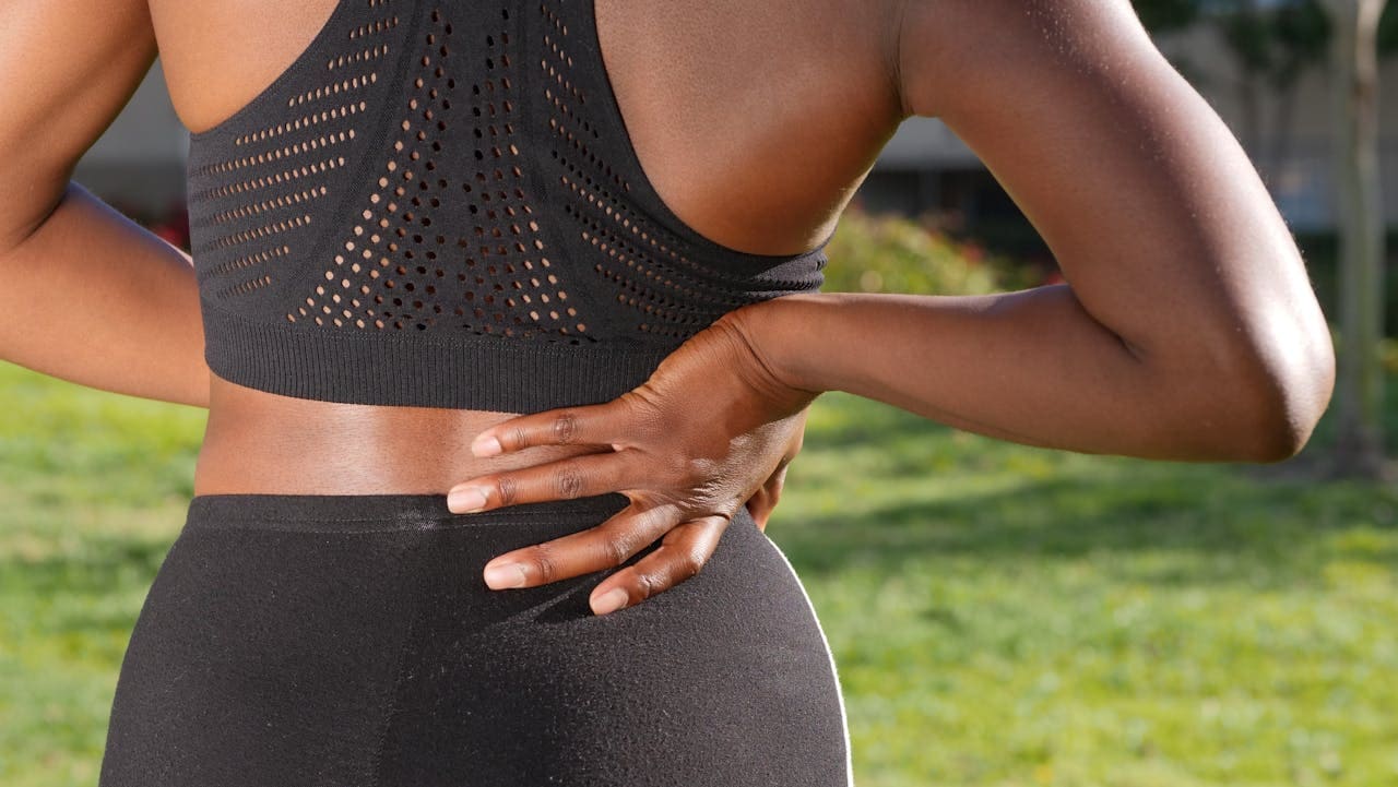 a woman experiencing pain in her back