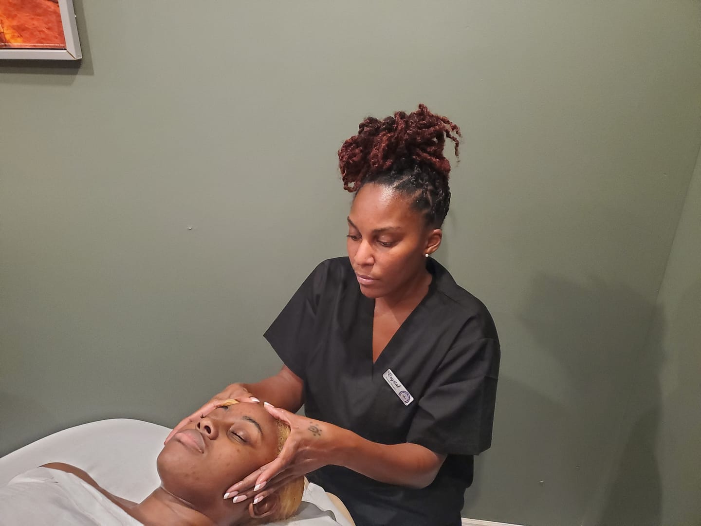 Therapist Massageing clients scap