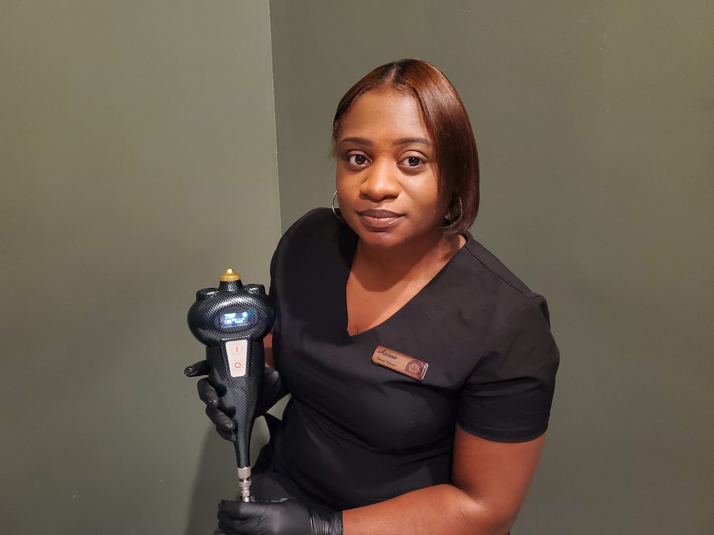 therapist holding cryotherapy device