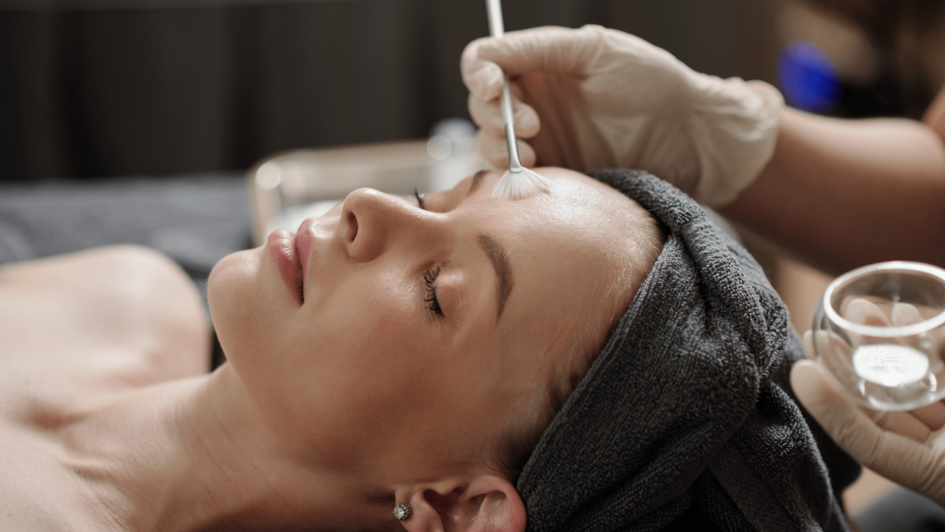 woman laying down getting a facial
