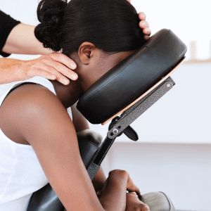woman in massage chair getting neck massage