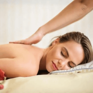 Woman laying face down getting massage