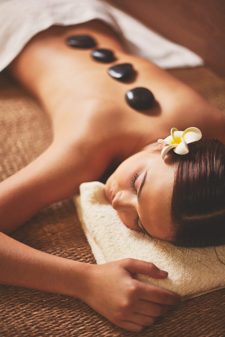 A beautiful woman gets massage and cryotherapy treatment at somatic spa & massage therapy in floral park new york