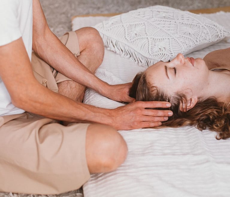 a person giving a head massage