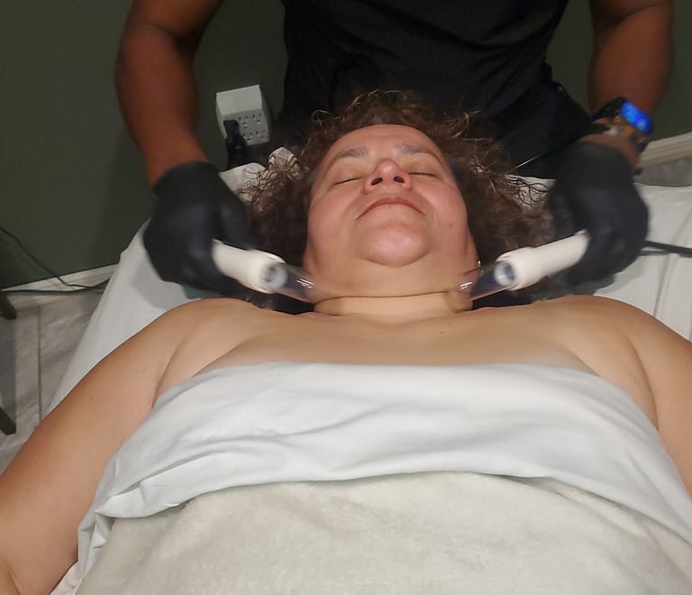 Lady laying on a massage table getting lymphatic enhancement therapy