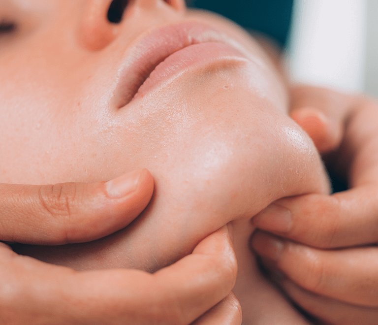 therapist fingers on clients chin