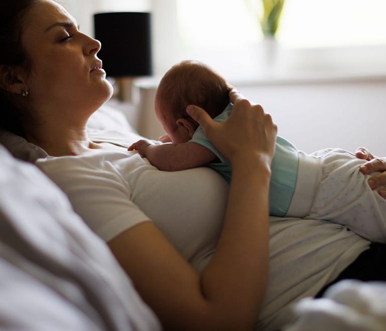 woman holding newborn
