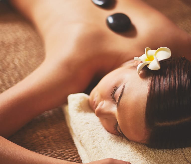 A beautiful woman gets massage and cryotherapy treatment at somatic spa & massage therapy in floral park new york