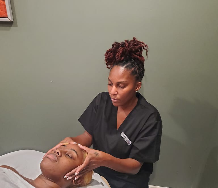 Therapist Massageing clients scap