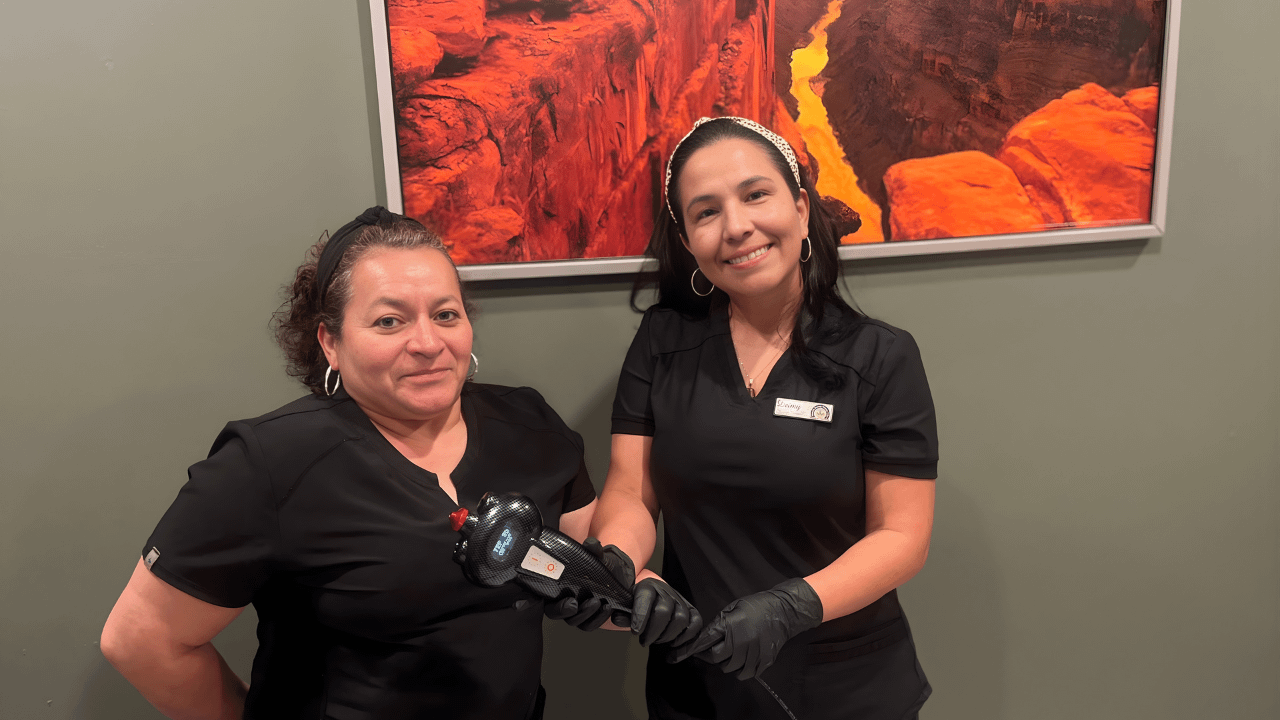 Female Therapists hold cryotherapy machine in Spa