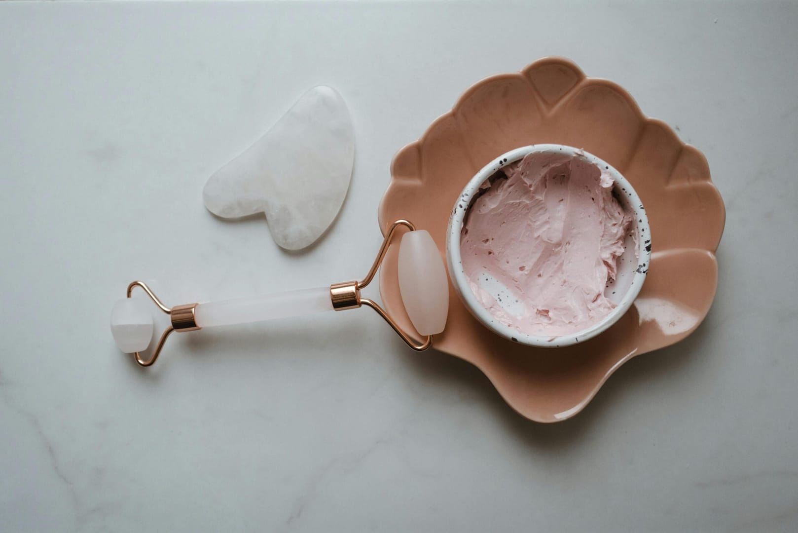 Gua sha tools on a granite top table