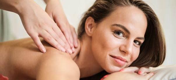 woman laying down getting massage